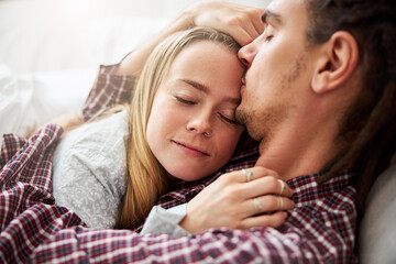 Beautiful young woman sleeping in boyfriend arms