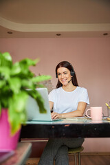 Pleasant worker eagerly beginning her working day