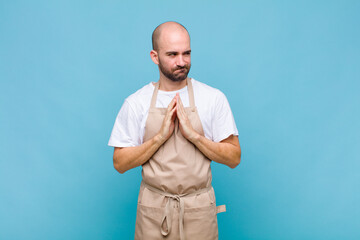 bald man feeling proud, mischievous and arrogant while scheming an evil plan or thinking of a trick