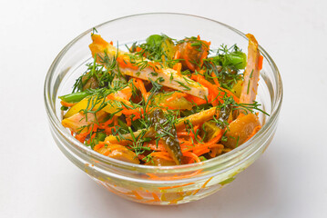 Salad food - mix vegetable salad served in a bowl over white background. Healthy eating, delicious snack or dinner.