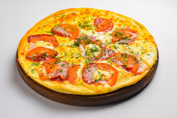 Pepperoni pizza on a white background. Traditional Italian pizza with tomatoes and meat isolated on white.