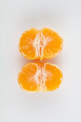 beautiful ripe peeled tangerine on a white background