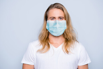 Photo of handsome serious confident young guy blonde long hair facial respirator isolated grey color background