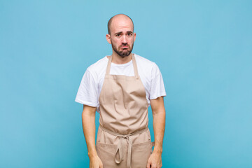 bald man feeling sad and whiney with an unhappy look, crying with a negative and frustrated attitude