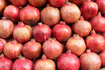 shot of many pomegranate in fruit market