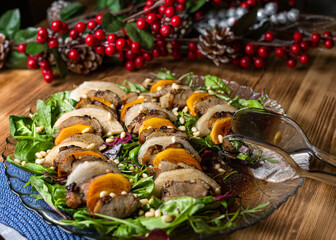 Fototapeta na wymiar Duck salad with pear on wooden background