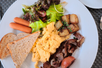 Closed-up Top-view of American Breakfast, Sausage, Omlete, Bacon ,Vegetable