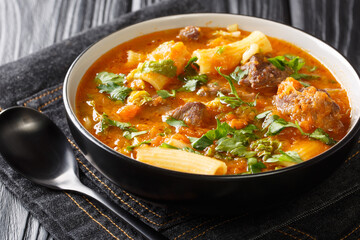Soup Joumou or Haitian Beef and Pumpkin Soup is a famous mildly spicy soup prepared with beef and...