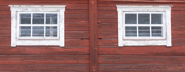 Fototapeta na wymiar Beautiful red wooden farmhouse painted in traditional Swedish color