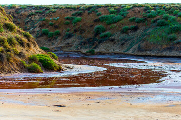 The water in the river is red due to iron saturation