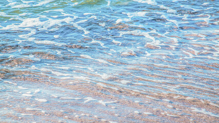 crystal clear azure water with sea foam, seascape background
