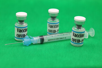 Covid19 SARS-Cov-2  syringe and vials vaccines with English text and Green Chroma background