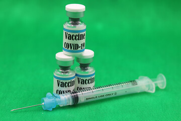 Covid19 SARS-Cov-2  syringe and vials vaccines with English text and Green Chroma background