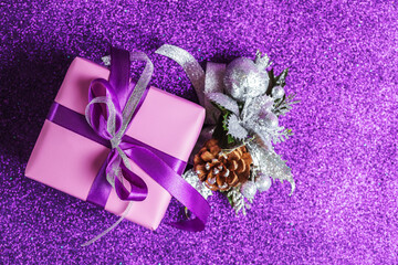 Turquoise boxes tied with silk ribbons on a shining pink background. Christmas decorations. New...