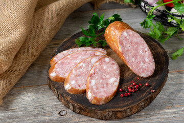 Sausage. Smoked sausage with spices on a wooden serving Board. Tasty meat sausages made from turkey meat. Copyspace	