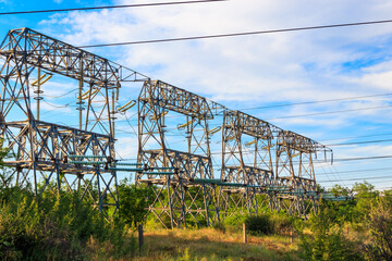 High voltage power line against blue sky
