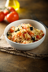 Warm bulgur salad with tomatoes and olives