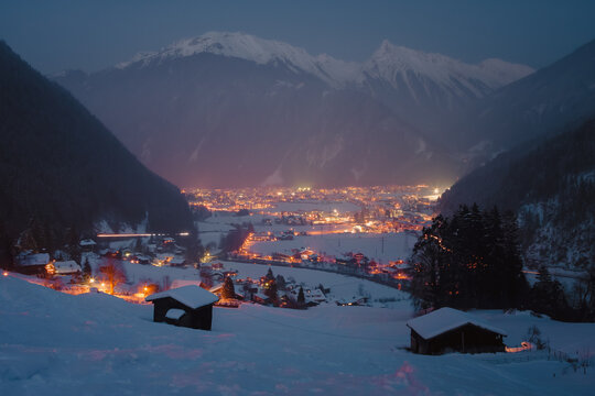 Winter evening in the Alpine village in the mountains. Mayrhofen is a ski resort centre. Austria. Zillertal valley