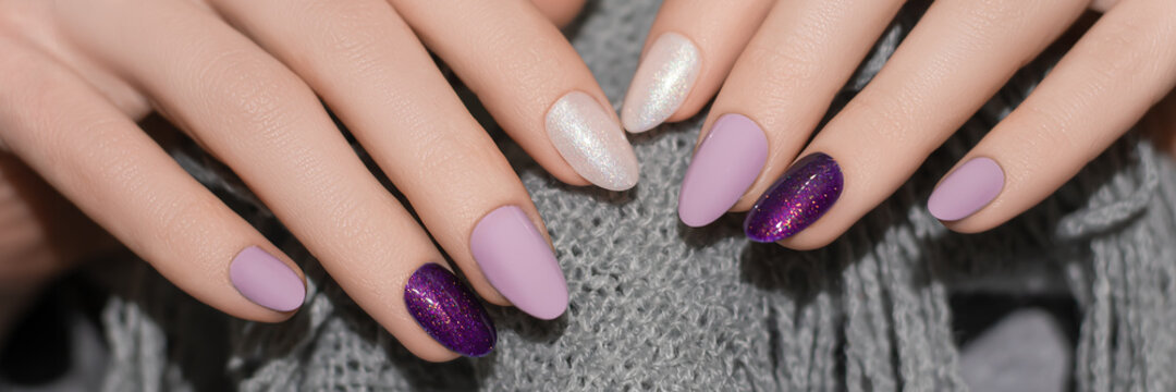 Female Hands With Glitter Nail Design. Purple Nail Polish Manicure. Woman Hands Hold Grey Wool Shawl. Banner Ad