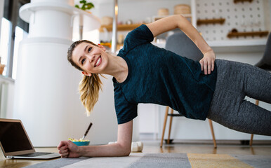 Fitness, sport home and diet concept. Happy fit woman exercising at home