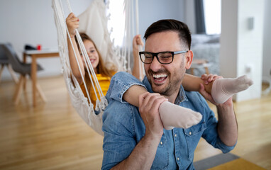 Happy loving family. Father and his daughter child girl playing together