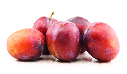 Composition with plums isolated on white background