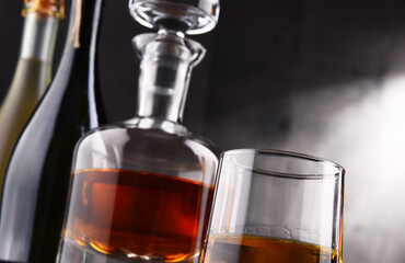 Composition with glass and carafe of hard liquor