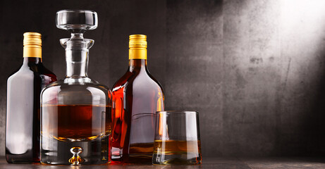 Carafe and bottles of assorted alcoholic beverages.