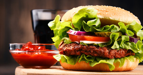 Homemade hamburger with cheese and fresh vegetables