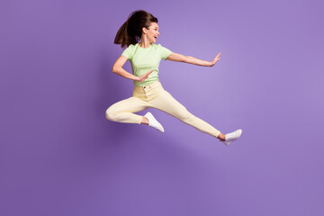Fototapeta na wymiar Full length body size view of her she nice attractive pretty lovely funky cheerful girl jumping having fun dancing fighting fooling isolated bright vivid shine vibrant lilac violet color background