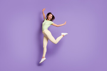 Full length body size view of her she nice attractive flexible sporty cheerful girl jumping having fun modern choreography isolated bright vivid shine vibrant lilac violet color background