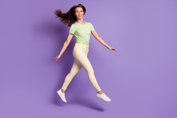 Full length body size view of her she nice attractive lovely cheerful cheery funky slender girl jumping going having fun isolated bright vivid shine vibrant lilac violet color background