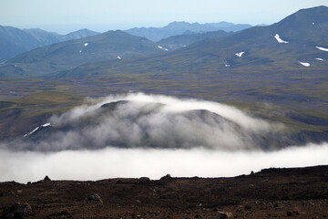 Kamchatka. Gorely Volcano (Burnt Volcano). A hill, hidden in morning fog. Archive photo, 2008