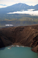 Kamchatka. Gorely Volcano (Burnt Volcano). Turquoise lake in the crater of a volcano. Archive...