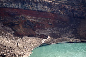 Kamchatka. Gorely Volcano (Burnt Volcano). Turquoise lake in the crater of a volcano. Archive...