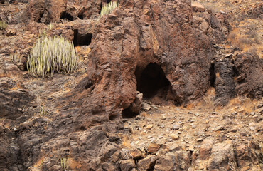 	Gran Canaria, landscapes along the hiking route around the ravive Barranco Hondo, The Deep Ravine at the southern part of the island, full of caves and grottoes, close to small village Juan Grande