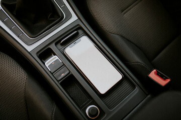 Obraz premium Blank screen mobile phone inside a car
