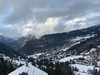 Winter landscape with mountain under evening sky.
