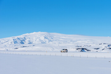 Typical Icelandic winter landscape with mountains under snow and blue sky. Beautiful winter...