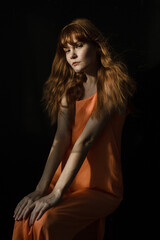 portrait of a woman with ginger hair and dress