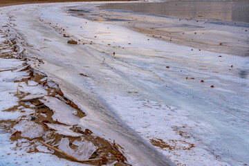 The frozen river bank. Winter background.