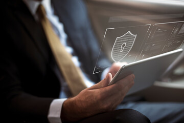 Businessman logging in to his tablet