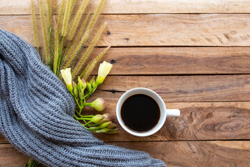knitting wool scarf with hot coffee espresso of lifestyle woman relax in winter season arrangement flat lay style on background wooden