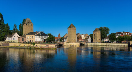 Fototapeta premium Old town water canal of Strasbourg, Alsace, France. Traditional half timbered houses of Petite France at dawn
