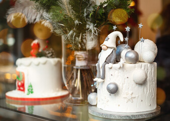Decorated white christmas cake with winter scene