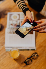Woman taking a flat lay photo