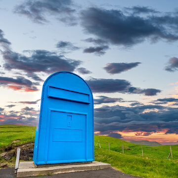 Huge postbox under the sky at dusk