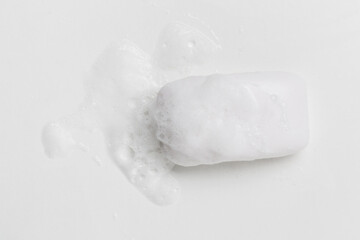 Soap with foam on a white background Soap used in everyday life, including washing, bathing