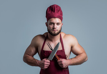 athletic guy with strong muscles in chef apron cooking food, butchery