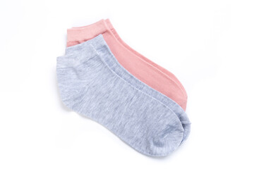 two pairs of colored short socks on a white background, top view